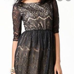 Lace overlay black cocktail dress